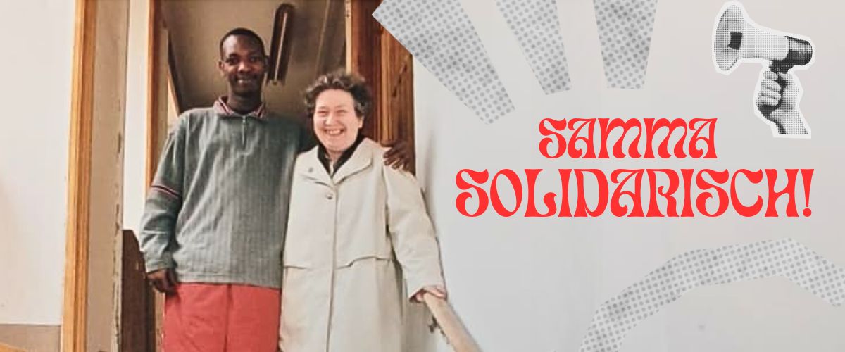 Frau Bock mit Klient und daneben großer Schriftzug "Samma Solidarisch"