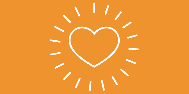 Weißes Linien eines Herz vor orangem Hintergrund